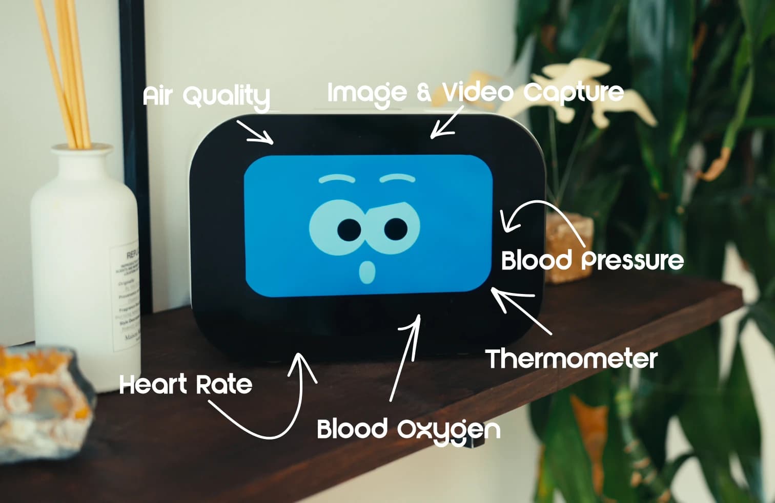 An older adult at home with Rhem, the AI home care robot, on a side table.