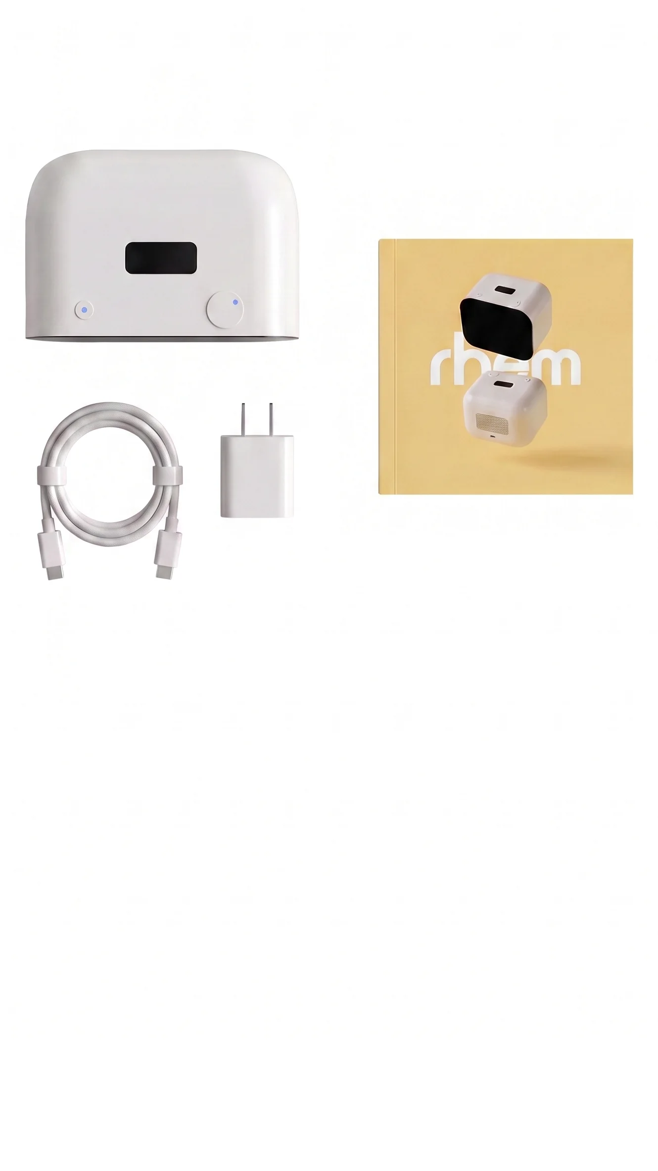 Vista cenital del contenido de la caja: el robot Rhem, un cable USB-C, un adaptador de carga y el manual de usuario